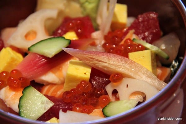 Morimoto's Chirashi comes in a deep red bowl. You can eat it with chopsticks, but I found the use of a long spoon much more satisfying.